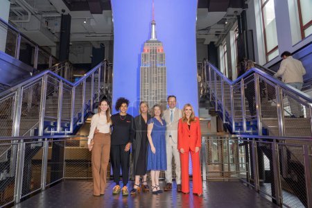 Photo for His Majesty's Consul General of New York Emma Wade-Smith Lights the Empire State Building in Celebration of the Coronation. May 05, 2023, New York, New York, USA: (L-R) Hannah Young, Jess Shadbolt, Shantell Martin - Royalty Free Image