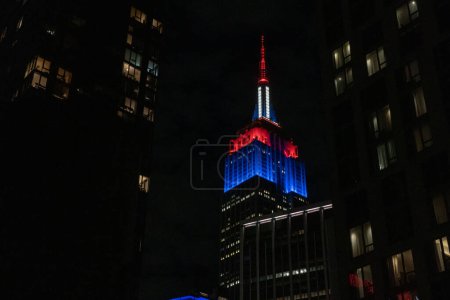 Photo for Empire State Building Lit Up With The Colors Of The Union Jack In Celebration Of The Coronation. May 06, 2023, New York, New York, USA: The Empire State Building is lit with the colors of the Union Jack in celebration of the coronation - Royalty Free Image