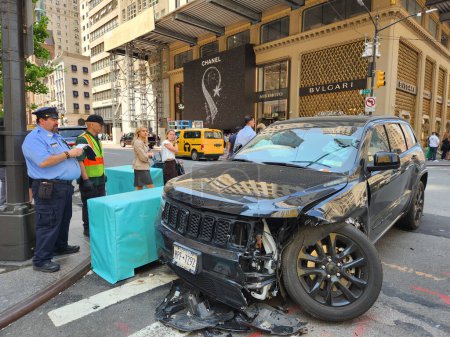 Photo for Accident involving two vehicles on 5th Avenue-New York. May 10, New York, USA: An accident involving two vehicles on 5th Avenue with 57 street in New York with no serious casualties. The police arrived at the local to investigate - Royalty Free Image