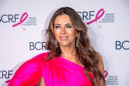 Photo for Breast Cancer Research Foundation Hot Pink Party. May 09, 2023, New York, New York, USA: Elizabeth Hurley (C) attends the Breast Cancer Research Foundation Hot Pink Party at The Glasshouse on May 9, 2023 in New York City. - Royalty Free Image