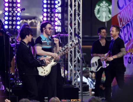 Photo for Jonas Brothers Perform live on Today Show. May 12, 2023, New York, USA: The Jonas Brothers are kicking off the Citi Concert Series live on TODAY in Rockefeller center. - Royalty Free Image