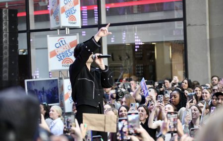 Photo for Jonas Brothers Perform live on Today Show. May 12, 2023, New York, USA: The Jonas Brothers are kicking off the Citi Concert Series live on TODAY in Rockefeller center. - Royalty Free Image