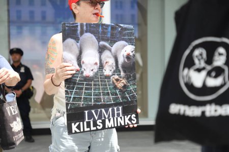 Photo for Protest against sale of Furs at Dior Store. May 13, 2023, New York, USA: A group of environmentalists protest against the sale of furs in front of the Dior store on 49th street with 5th Avenue, on New York. - Royalty Free Image