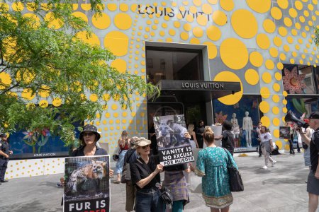 Photo for (NEW) Anti-Fur Protest. May 13, 2023, New York, New York, USA: Animal Rights protesters holding signs during a protest in front of the Louis Vuitton store on Fifth Avenue during an Anti-Fur Protest on May 13, 2023 in New York City.   Animal rights ac - Royalty Free Image