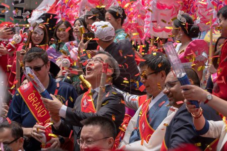 Photo for Second Annual Asian American Pacific Islander (AAPI) Cultural Heritage Parade. May 21, 2023, New York, New York, USA: Ping HUANG (c), Consul General of the People&#39;s Republic of China in New York, shoots confetti celebrating - Royalty Free Image