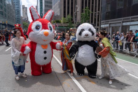 Photo for Second Annual Asian American Pacific Islander (AAPI) Cultural Heritage Parade. May 21, 2023, New York, New York, USA: Participants wearing a Rabbit and Panda costumes march at the Second Annual Asian American and Pacific Islander (AAPI) - Royalty Free Image