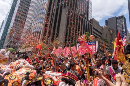 Photo for Second Annual Asian American Pacific Islander (AAPI) Cultural Heritage Parade. May 21, 2023, New York, New York, USA: Participants shoot confetti celebrating the start of the Second Annual Asian American and Pacific Islander (AAPI) - Royalty Free Image