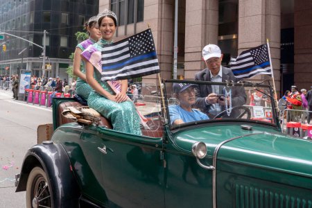 Photo for Second Annual Asian American Pacific Islander (AAPI) Cultural Heritage Parade. May 21, 2023, New York, New York, USA: Participants ride in a car during the New York City Second Annual Asian American and Pacific Islander (AAPI) Cultural Heritage - Royalty Free Image