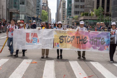 Photo for Second Annual Asian American Pacific Islander (AAPI) Cultural Heritage Parade. May 21, 2023, New York, New York, USA: UA3 members walk with a banner that reads &quot;STOP THE HATE&quot; during the New York City - Royalty Free Image