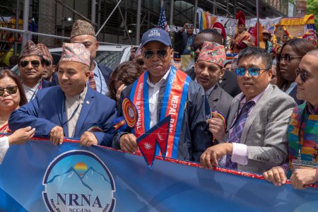 Photo for Nepal Day Parade 2023. May 21, 2023, New York, New York, USA: New York City Mayor Eric Adams cuts the parade's ribbon to the New York City Nepal Day Parade on Madison Avenue on May 21, 2023 in New York City. - Royalty Free Image