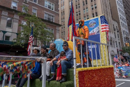 Photo for Nepal Day Parade 2023. May 21, 2023, New York, New York, USA: An exhibit of high altitude mountain climber equipped with oxygen seen on a float at the New York City Nepal Day Parade on Madison Avenue on May 21, 2023 in New York City. - Royalty Free Image