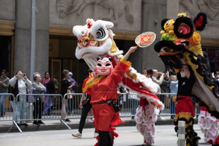 Photo for Baby Face and Dragons at the second annual AAPI Parade on Sixth Avenue (Avenue of the Americas). May 21, 2023. New York, USA The Asian American and Pacific Islander (AAPI) Cultural and Heritage Parade - Royalty Free Image