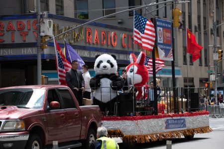 Photo for Panther and Rabbit on a float, United we Stand at the second annual AAPI Parade on Sixth Avenue (Avenue of the Americas). May 21, 2023. New York, USA The Asian American and Pacific Islander (AAPI) Cultural and Heritage Parade - Royalty Free Image