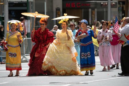 Photo for Asian women with traditional dress attire at the second annual AAPI Parade on Sixth Avenue (Avenue of the Americas). May 21, 2023. New York, USA The Asian American and Pacific Islander (AAPI) Cultural and Heritage Parade - Royalty Free Image