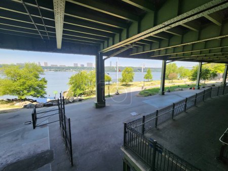 Photo for Riverside Park Conservancy-NYC. June 01, 2023, New York, USA: Movement of people along the Hudson River waterfront from Riverside Drive to Jeffrey's Hook Lighthouse where the George Washington Bridge is located. - Royalty Free Image