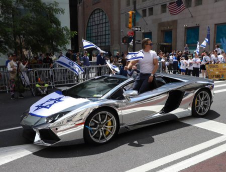 Photo for Celebrate 75th Israel Parade: Reviewing The Hope with Protest. June 4, 2023, New York, USA: Jewish people are celebrating 75 years of Israel existence between 57th and 74th streets on 5th avenue New York . - Royalty Free Image
