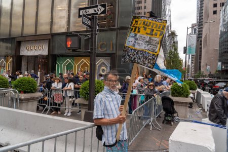 Photo for The 2023 Celebrate Israel Parade. June 04, 2023, New York, New York, USA: A spectator holds a sign against the government's judicial overhaul push at the Celebrate Israel Parade on June 4, 2023 in New York City. - Royalty Free Image