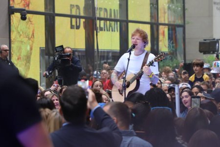 Photo for Ed Sheeran Performs live on Today Show. June 6, 2023, New York, USA: Ed Sheeran performs at the Citi Concert Series live on TODAY Plaza in Rockefeller center with the presence of fans screaming and singing all their songs. - Royalty Free Image