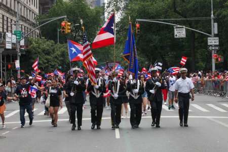 Photo for National Puerto Rican Day Parade. June 11, 2023, New York, USA: The National Puerto Rican Day Parade which is the largest demonstration of cultural pride takes place on 5th Avenue in New York with people lining up the avenue dancing and cheering - Royalty Free Image