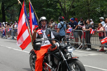 Photo for National Puerto Rican Day Parade. June 11, 2023, New York, USA: The National Puerto Rican Day Parade which is the largest demonstration of cultural pride takes place on 5th Avenue in New York with people lining up the avenue dancing and cheerin - Royalty Free Image