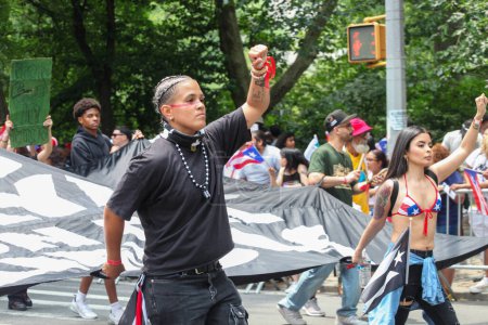 Photo for National Puerto Rican Day Parade. June 11, 2023, New York, USA: The National Puerto Rican Day Parade which is the largest demonstration of cultural pride takes place on 5th Avenue in New York with people lining up the avenue dancing and cheerin - Royalty Free Image