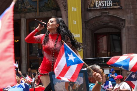Photo for National Puerto Rican Day Parade. June 11, 2023, New York, USA: The National Puerto Rican Day Parade which is the largest demonstration of cultural pride takes place on 5th Avenue in New York with people lining up the avenue dancing and cheering - Royalty Free Image