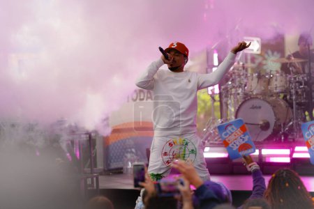 Photo for Chance The Rapper on the Today Show. June 15, 2023, New York, USA: Chance The Rapper performed today on the Today Show here at Rockefeller Plaza. He is a rapper, singer, songwriter, and actor from Chicago, Illinois. - Royalty Free Image