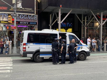 Photo for NYPD arrests illegal dealers at Time Square. June 15, 2023, New York, USA: NYPD is at full force to clean any illegal deals going on at Times Square as they arrest two suspects and whisked them to a nearby Police station - Royalty Free Image