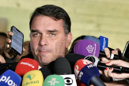 Photo for Brasilia (DF), Brazil 06/21/2023 - Senator Flavio Bolsonaro (PL-RJ) speaks to the press after leaving the CCJ room where Cristiano Zanin Martins nominated for minister of the STF; on the afternoon of this Wednesday, June 21, 2023 man - Royalty Free Image
