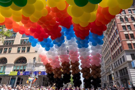 Photo for 2023 New York City Pride March. June 25, 2023, New York, New York, USA: Marchers with a balloons display in rainbow flag colors participate in the annual New York City Pride Parade on June 25, 2023 in New York City. - Royalty Free Image