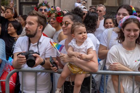 Photo for 2023 New York City Pride March. June 25, 2023, New York, New York, USA: Spectators with pride flags watch the annual New York City Pride Parade on June 25, 2023 in New York City. - Royalty Free Image