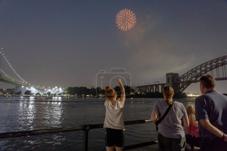 Photo for (NEW) Independence Day Celebrations. June 29, 2023, New York, New York, USA: Fireworks explode over the Hell Gate Bridge during the Central Astoria annual Independence Day Celebrations fireworks display in Astoria Park on June 29th, 2023 - Royalty Free Image