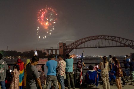 Photo for (NEW) Independence Day Celebrations. June 29, 2023, New York, New York, USA: Spectators gather for the Central Astoria annual Independence Day Celebrations fireworks display in Astoria Park on June 29th, 2023 in the Queens borough of New York City. - Royalty Free Image