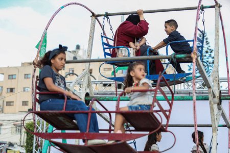 Photo for (INT) Children in Gaza enjoying the Eid al-Adha holiday. June 30, 2023, Gaza, Palestine: Palestinian children from Gaza City go to parks to spend good time in light of the Eid al-Adha holiday. - Royalty Free Image