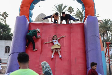 Photo for (INT) Children in Gaza enjoying the Eid al-Adha holiday. June 30, 2023, Gaza, Palestine: Palestinian children from Gaza City go to parks to spend good time in light of the Eid al-Adha holiday. - Royalty Free Image