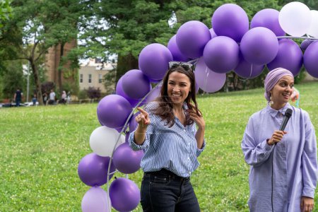 Photo for Alexandria Ocasio-Cortez Attends an Eid Al Adha Event at Astoria Park. July 08, 2023, New York, USA: U.S. Representative Alexandria Ocasio-Cortez (L) attends an Eid Al Adha event at Astoria Park on July 8, 2023 in the Queens borough of New York City - Royalty Free Image
