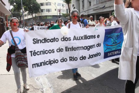 Photo for Rio de Janeiro (RJ), Brazil - 07/10/2023 - MANIFESTACAO/SAUDE/SALARY/RJ - Nurses in the health area hold a demonstration in the central region of Rio de Janeiro, demanding better wages, payment of the minimum wage and adequate working conditions - Royalty Free Image