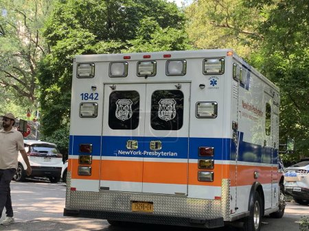 Photo for New York, USA - July 12, 2023: A woman was treated by Paramedics right inside an ambulance at Central Park Zoo and there was no need to go to a hospital. She felt better afterwards. According to a Park worker, the woman complained of not feeling well - Royalty Free Image
