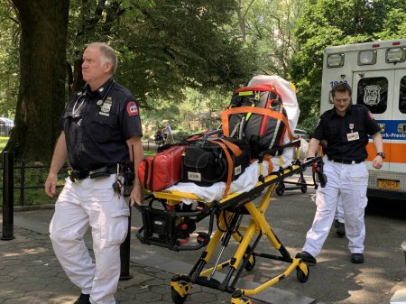 Photo for New York, USA - July 12, 2023: A woman was treated by Paramedics right inside an ambulance at Central Park Zoo and there was no need to go to a hospital. She felt better afterwards. According to a Park worker, the woman complained of not feeling well - Royalty Free Image