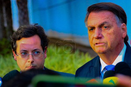 Photo for Brasilia (DF), Brazil - 07/12/2023 - POLITICS/PF/BOLSONARO - Former President of the Federative Republic of Brazil Jair Messias Bolsonaro speaks to the press on his way out after giving testimony to the PF this Wednesday, July 12, 2023 - Royalty Free Image