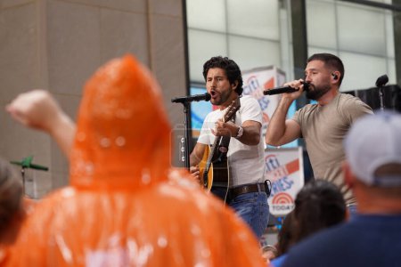 Photo for Dan + Shay Performed live Citi Concert Series on the Today Show at Rockefeller Plaza, July 21, 2023, New York , USA: Despite the rain, Dan & Shay stole the show this morning at Rockefeller Plaza on the Today Show. - Royalty Free Image