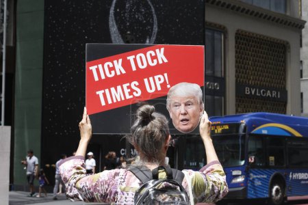 Photo for Protest in favor of Trump's Indictment at Trump Tower.  August 02, 2023, New York, USA: A handful of protesters gathered in front of Trump Tower supporting the third indictment of Trump by special counsel Jack Smith - Royalty Free Image