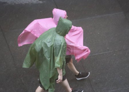 Photo for New Yorkers Under Severe Weather. August 10, 2022, New York, USA: New Yorkers are faced with heavy rainfall under severe weather as declared by the weather forecast for Thursday (10). There is an expectation of thunderstorms through 7pm. - Royalty Free Image