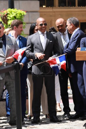 Photo for Mayor Adams delivers Remarks at Dominican Republic Flag Raising Ceremony. August 11, 2023, New York, USA: The Mayor of New York City, Eric Adams, delivers remarks at Flag-Raising Ceremony for Dominican Republic at Bowling Green Park Whitehall - Royalty Free Image