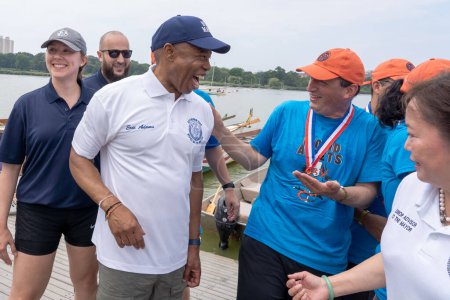 Photo for Hong Kong Dragon Boat Festival in New York (HKDBF-NY). August 12, 2023, New York, New York, USA:New York City Mayor Eric Adams and Comptroller Brad Lander meet after racing in the 31st Hong Kong Dragon Boat Festival in New York (HKDBF-NY) - Royalty Free Image