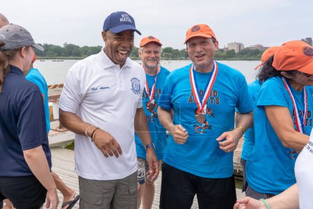 Photo for Hong Kong Dragon Boat Festival in New York (HKDBF-NY). August 12, 2023, New York, New York, USA:New York City Mayor Eric Adams and Comptroller Brad Lander meet after racing in the 31st Hong Kong Dragon Boat Festival in New York (HKDBF-NY) - Royalty Free Image