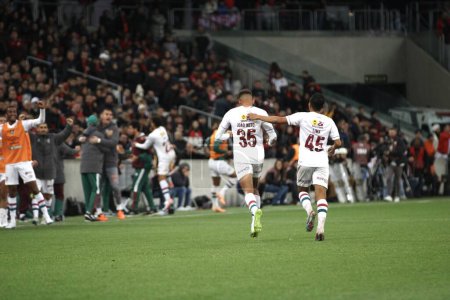 Photo for CURITIBA (PR), Brazil - August 27, 2023: Joao Neto scores and celebrates Fluminense's second goal during the match between Athletico Pr and Fluminense valid for the 21st round of the 2023 Brazilian Championship, at Ligga Arena - Royalty Free Image