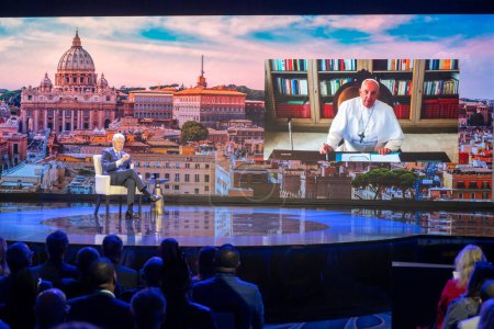 Photo for Clinton Global Initiative 2023 Meeting. September 18, 2023, New York, New York, USA: Former President Bill Clinton speaks to Pope Francis via video call during the Clinton Global Initiative (CGI) meeting at the Hilton Midtown - Royalty Free Image