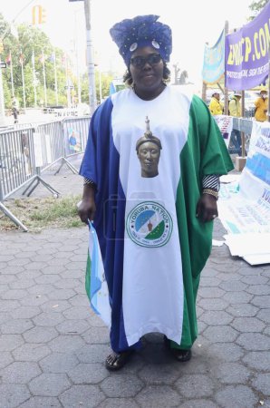 Photo for Nigerians protesting and demanding a separate Yoruba Nation in front of UN. September 20, 2023, New York, USA: Some Nigerians; Yoruba tribe, dressed in Yoruba attires, are protesting and demanding a separate country to be called Yoruba land - Royalty Free Image