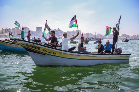 Téléchargez les photos : Les Palestiniens protestent et exigent la levée du blocus israélien sur Gaza. - en image libre de droit